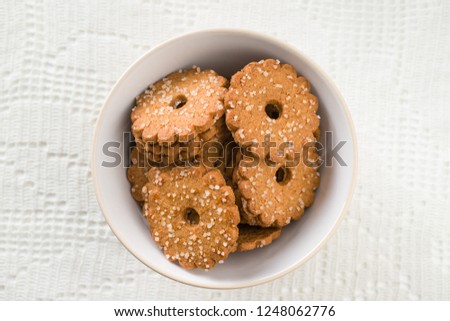 Christmas biscuits with sugar crystals in bowl.