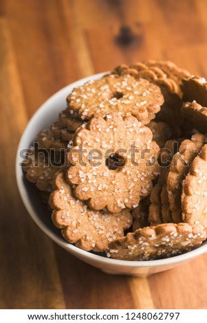 Christmas biscuits with sugar crystals in bowl.