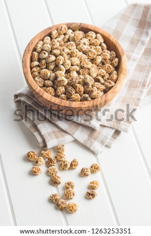 Tiger nuts. Tasty chufa nuts. Healthy superfood on white table.