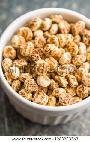 Tiger nuts. Tasty chufa nuts. Healthy superfood in bowl.