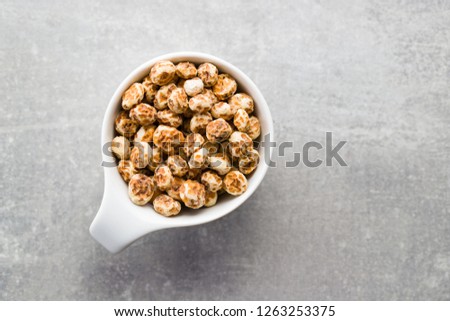 Tiger nuts. Tasty chufa nuts. Healthy superfood in bowl.