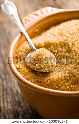 the brown sugar in silver spoon