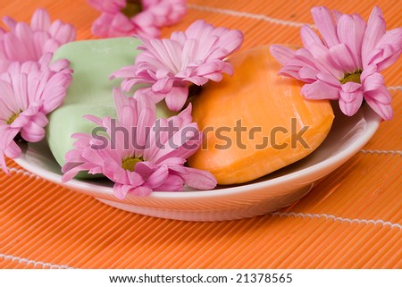 orange soap with pink blooms