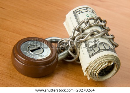 locked money with padlock