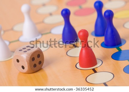 the board game with color pawns