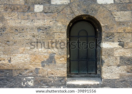 the antique window in stone wall