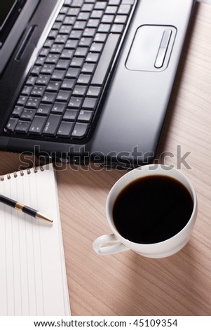 the coffee cup and computer - break in office