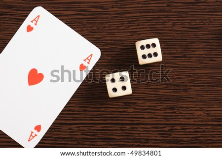 ace and dices on wooden table