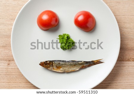 the face maked with vegetable and sprat