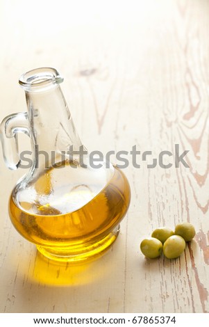 green olives and oil on kitchen table