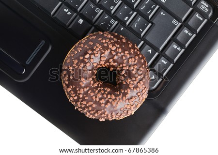 the break in the  office . doughnut on laptop keyboard