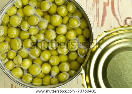 canned green peas in open tin can