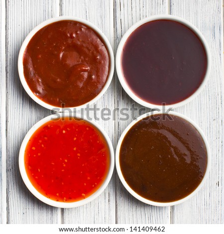 The Various Barbecue Sauces In Ceramic Bowls