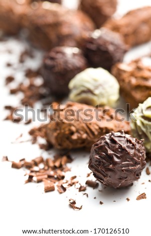 mix of chocolate truffles on white background