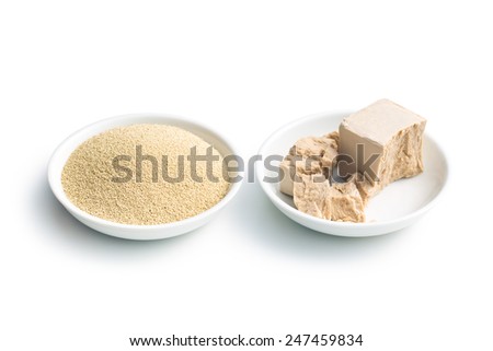 fresh and dry yeast in bowl  on white background