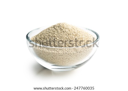 dry yeast in bowl on white background