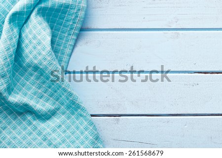 the background made from checkered napkin on blue table