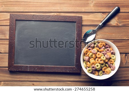 the chalkboard and colorful cereal rings in spoon