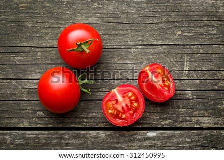 chopped tomatoes on old wooden table