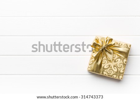 gold gift box on white table