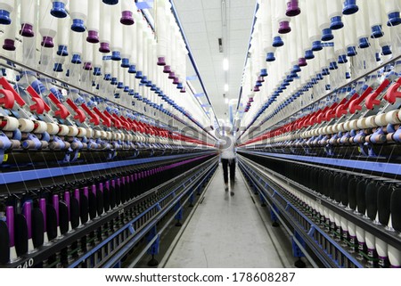 LUANNAN county - December 13: a functioning of spinning equipment is operating within the factory, ze the spinning mill on December 13, 2013, LUANNAN county, hebei province, China.
