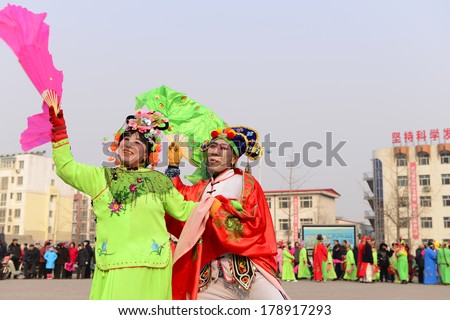 LUANNAN COUNTRY, CHINA - February 13, 2014: people wearing colorful clothes to yangko dance performances in square, hebei province