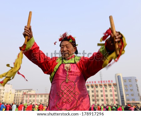 LUANNAN COUNTRY, CHINA - February 11, 2014: people wearing colorful clothes to yangko dance performances in square, hebei province
