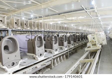 LUANNAN, CHINA - JAN 5: ceramic toilet line in factory workshop, on January 5, 2014, LUANNAN county, hebei province, China.