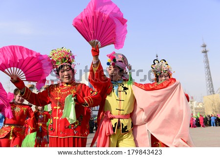 LUANNAN county - Feb. 18: people wearing colorful clothes to yangko dance performances in square,  On February 18, 2013, LUANNAN county, hebei province, China.