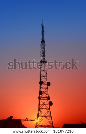 The towering radio towers under the sunset