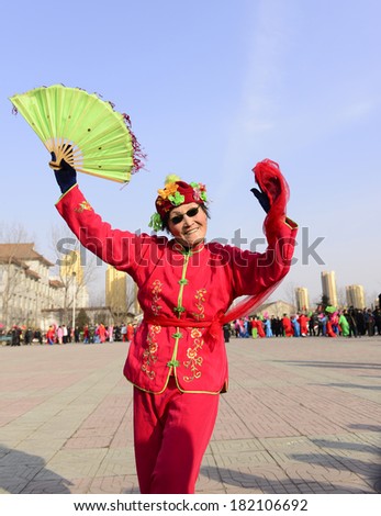LUANNAN county - Feb. 18: people wearing colorful clothes to yangko dance performances in square, on February 18, 2013, LUANNAN county, hebei province, China.