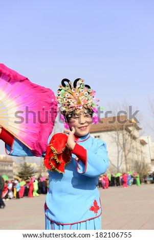 LUANNAN county - Feb. 18: people wearing colorful clothes to yangko dance performances in square, on February 18, 2013, LUANNAN county, hebei province, China.