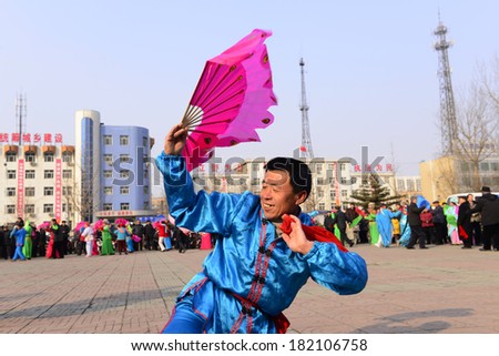 LUANNAN county - February 8: people wearing colorful clothes to yangko dance performances in square, on February 8, 2014, LUANNAN county, hebei province, China.