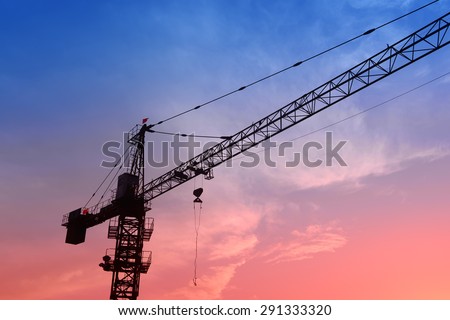 Crane on the construction site in the sunset