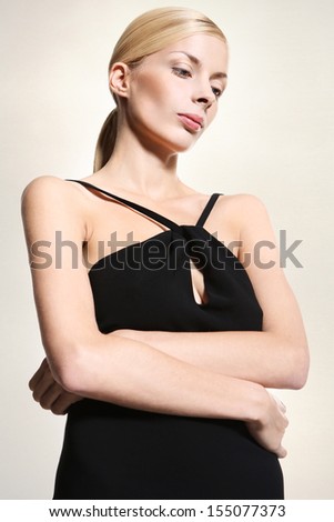 Sad woman in a black dress