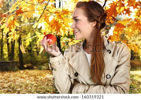 portrait of a beautiful woman in autumn scenery