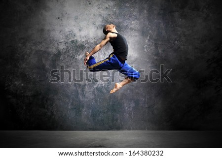 Young Dancer Is Jumping On Stage /Modern Urban Dance