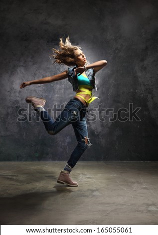 Pirouette, outside dance /Young energetic dancer performs modern dance pose