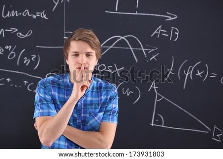 Student at the blackboard . Student at blackboard background saved mathematical formulas