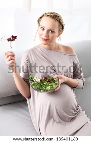 Healthy Nutrition in pregnancy .Young mom takes care of a healthy diet for yourself and your unborn child