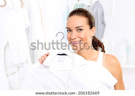 Sale, woman shopping .Woman shopping in a clothing boutique,