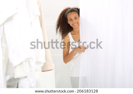shopping . Sale, woman shopping .   The dark-skinned woman shopping in a clothing boutique,