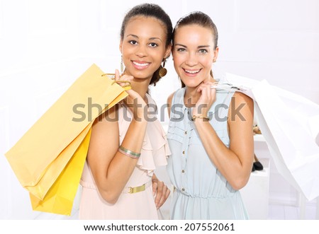 Friends of paper shopping bags .Two woman with paper shopping bags