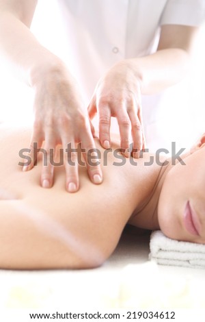 Acupressure point massage, a woman a massage  .Slimming massage .Attractive blonde woman in the office spa, relax with a massage