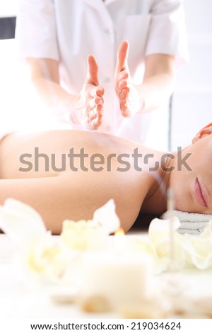 Shiatsu Japanese massage, relax in the spa  .Attractive blonde woman in the office spa, relax with a massage