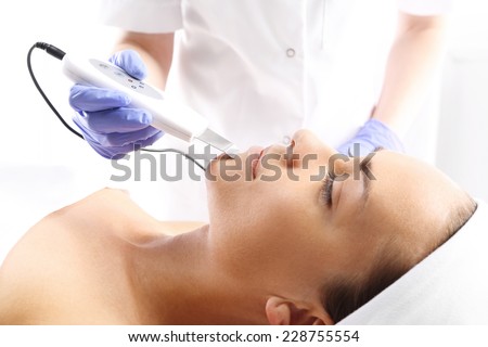 Cavitation peeling, beauty treatment on face. The woman\'s face during a facial at a beauty salon