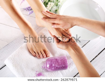 Pedicure and foot massage.Woman in a beauty salon for pedicure and foot massage.