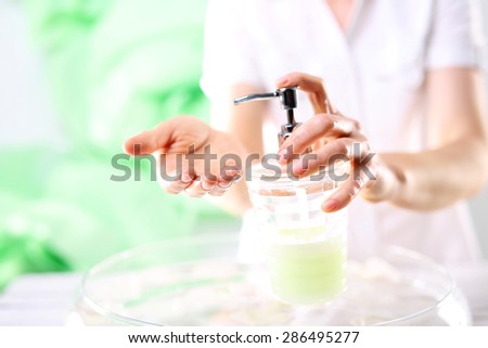 Beautiful well cared for hands. A woman washes her hands