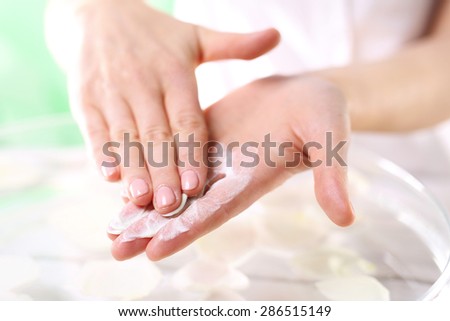 Grained hand peeling.Wellness and spa scrub hands. Grained hand peeling.The woman imposes on hand scrub cosmetic