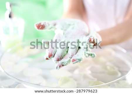 Hands, hand hygiene.\
A woman washes her hands with soap in foam